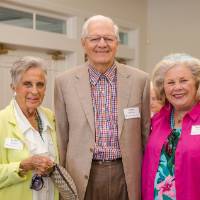 Three guests standing together, posing at Naples 2019